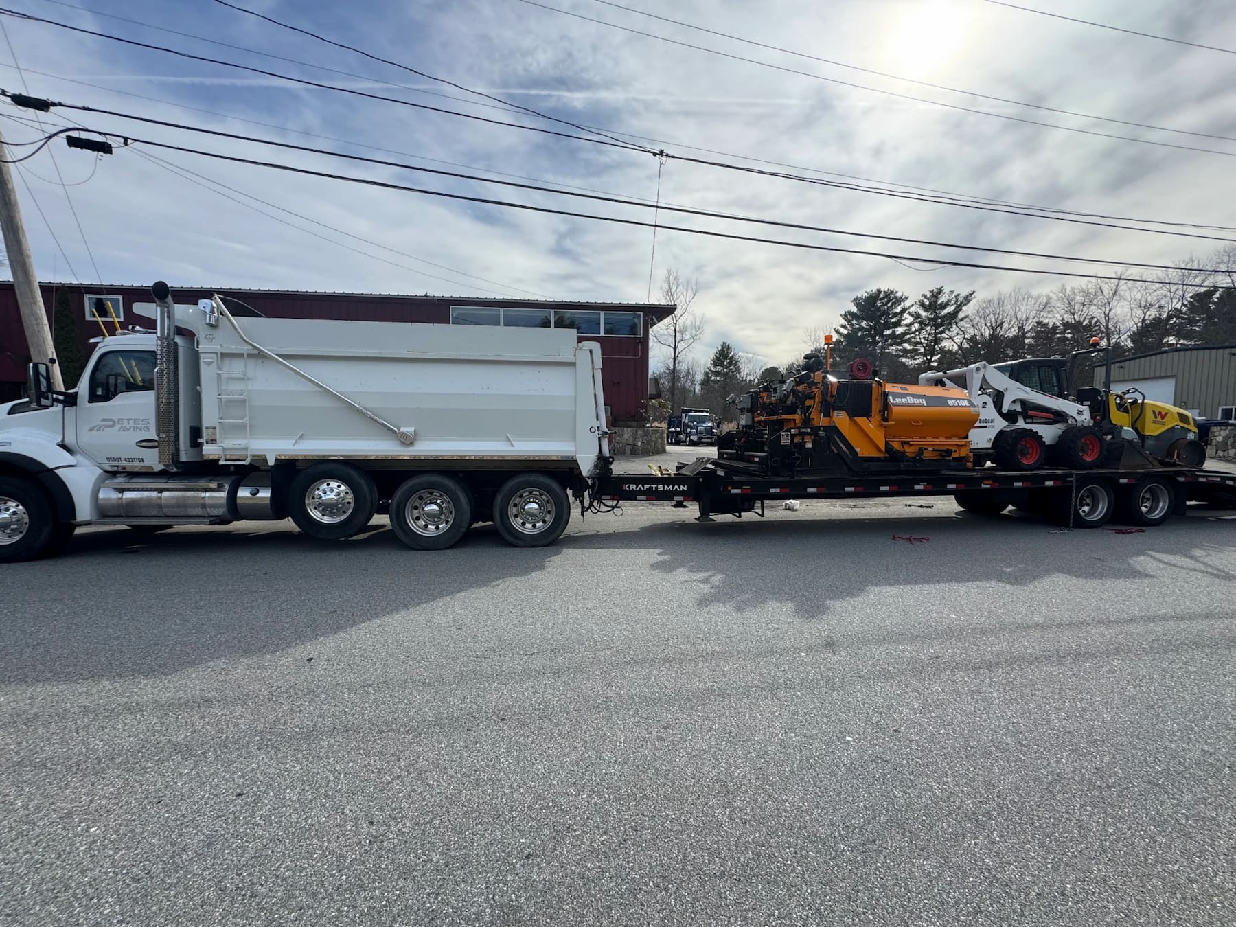 Freshly paved residential driveway with smooth asphalt finish in Marshfield, MA
