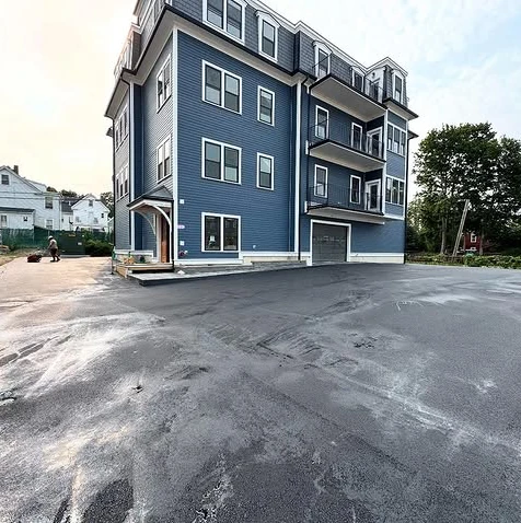 Finished residential lot with durable asphalt surface
